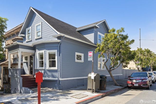 a front view of a house with parking area