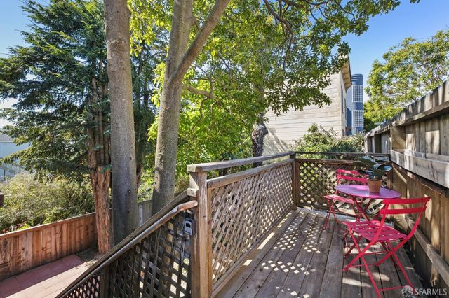 a view of street from balcony