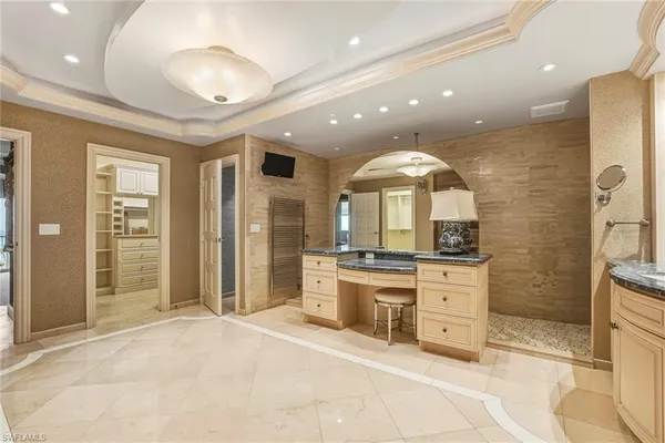 a large kitchen with stainless steel appliances kitchen island granite countertop a stove and a sink with granite countertops