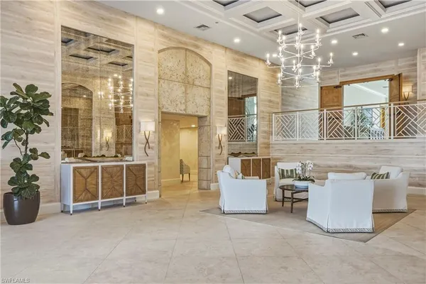 a view of a livingroom with furniture and chandelier