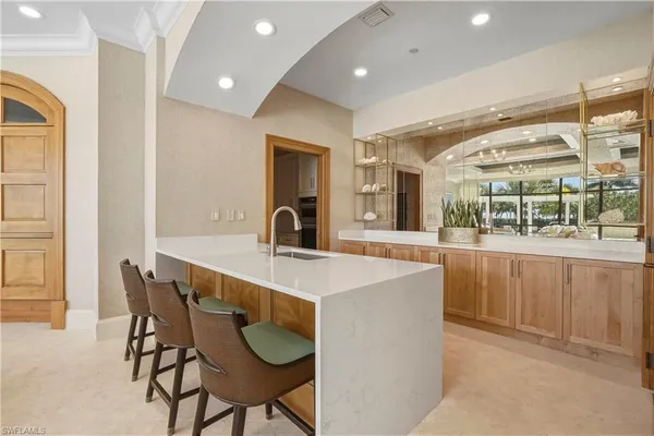 a kitchen with a table and chairs in it