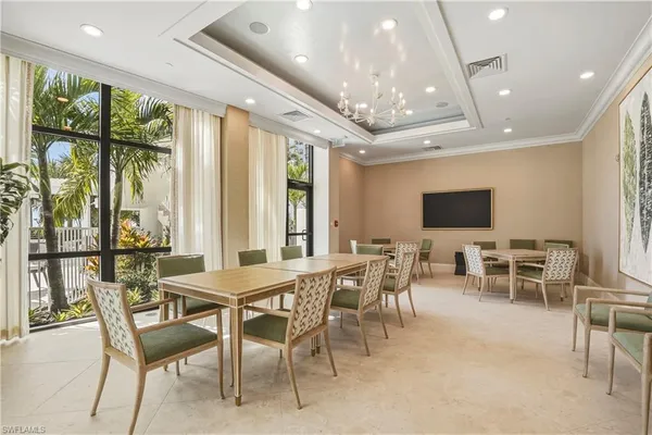 a view of a dining room with furniture window and outside view