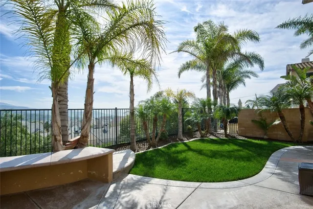 a view of a backyard with a planted pot