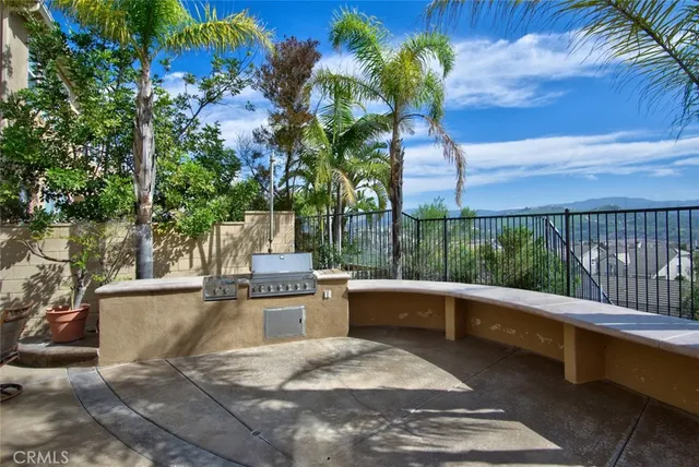 a view of backyard with swimming pool and outdoor seating