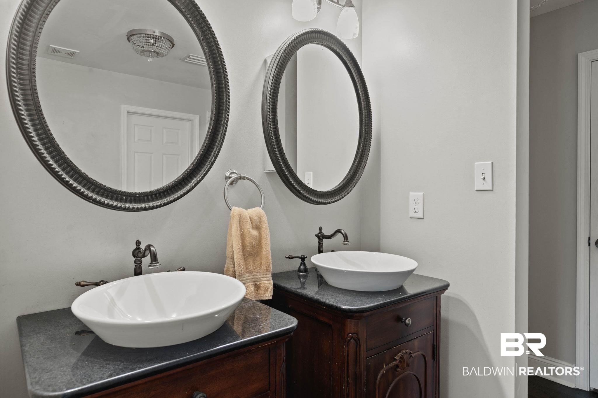 22810 High Ridge Road Fairhope, AL 36532 - Photo 36 of 78 Dual vessel sinks on dark wood-finish vanities with dark countertops