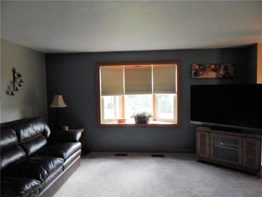 439 Tivoli Road Pittsburgh, PA 15239 - Photo 7 of 23 LIVING ROOM WITH LOVELY BAY WINDOW AND NEW WALL TO WALL CARPETING.