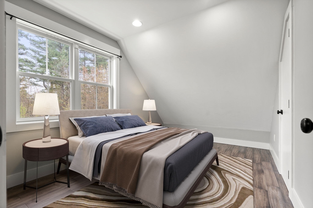 29 Heywood Road Ashby, MA 01431 - Photo 22 of 33 a bedroom with a bed and a table