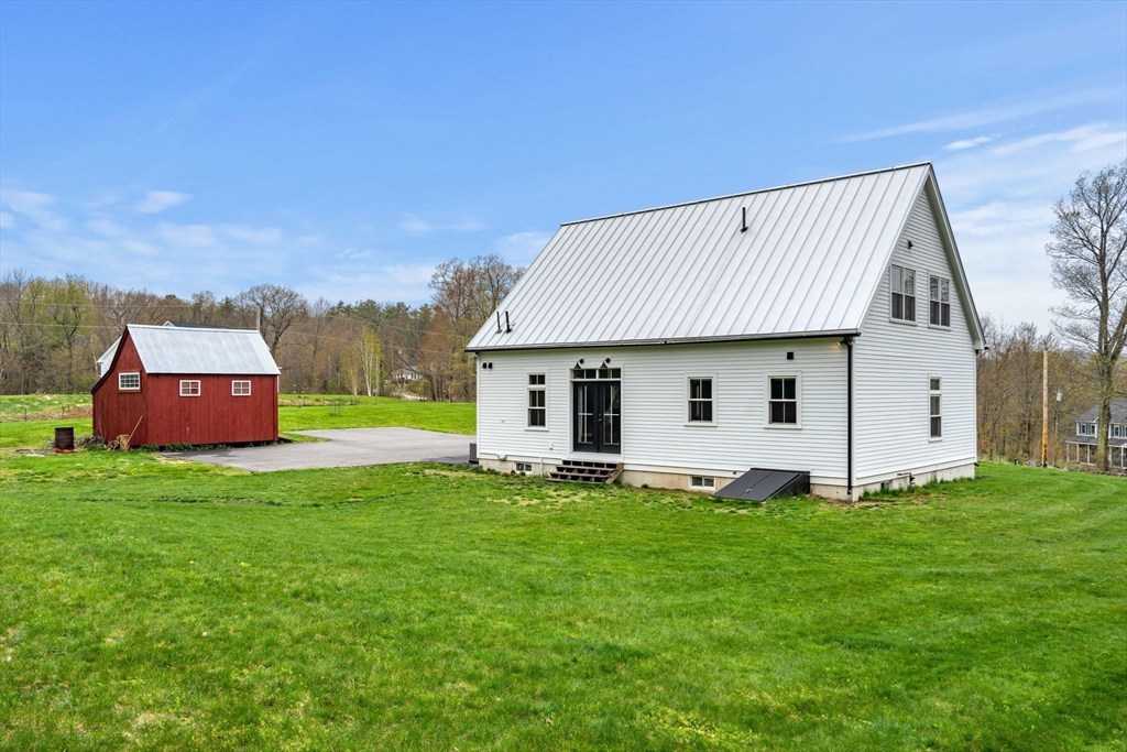 29 Heywood Road Ashby, MA 01431 - Photo 27 of 33 a front view of house with yard and trees