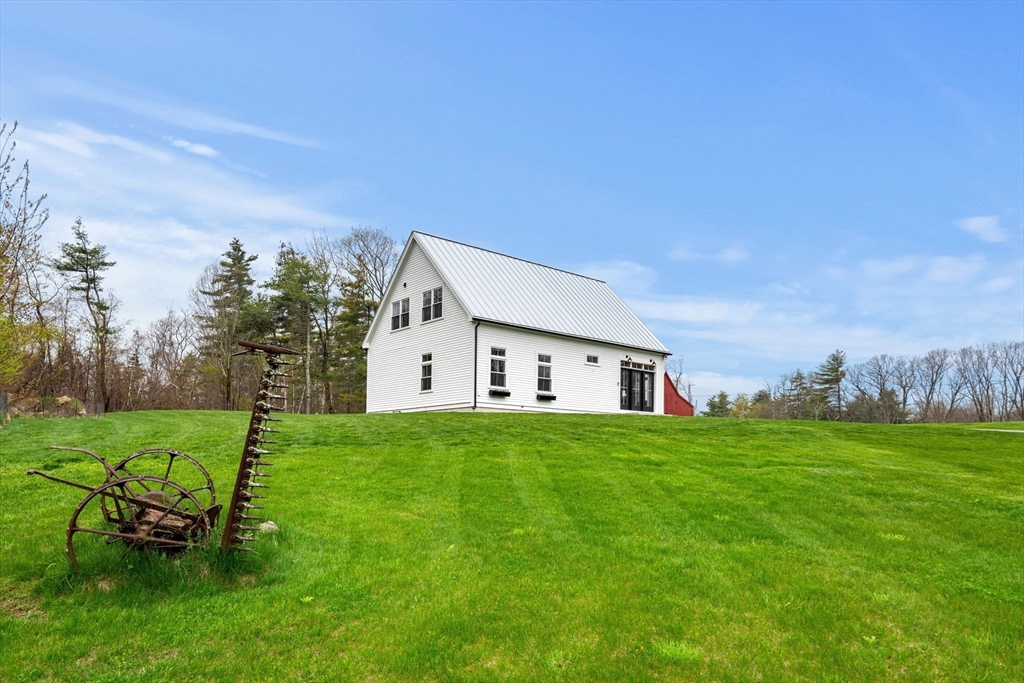 29 Heywood Road Ashby, MA 01431 - Photo 28 of 33 a house view with a garden space