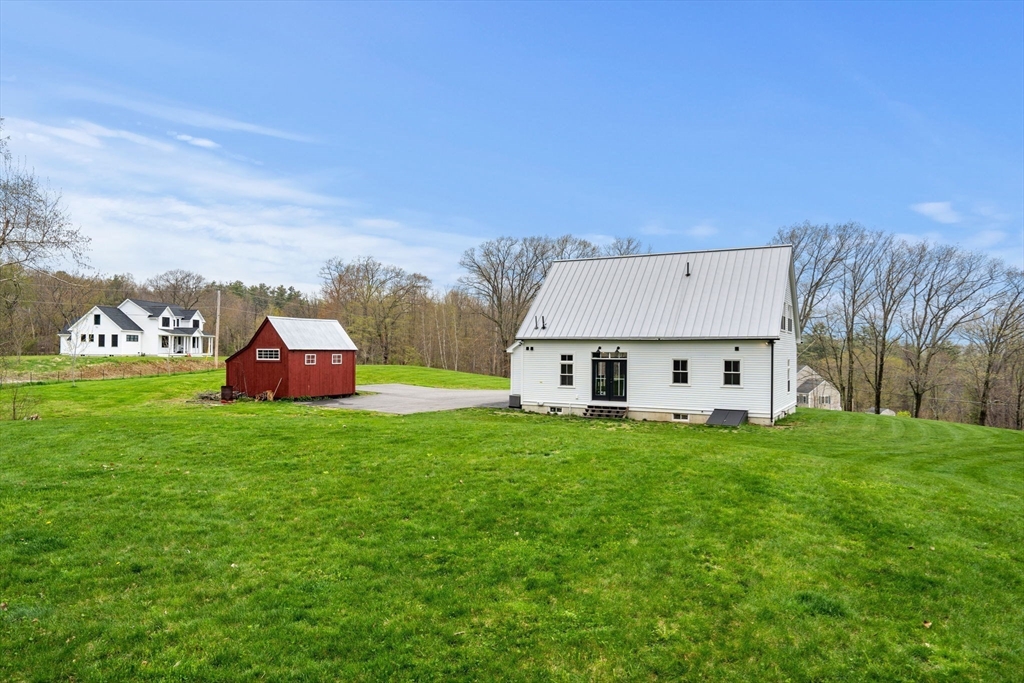 29 Heywood Road Ashby, MA 01431 - Photo 30 of 33 a view of a house with backyard
