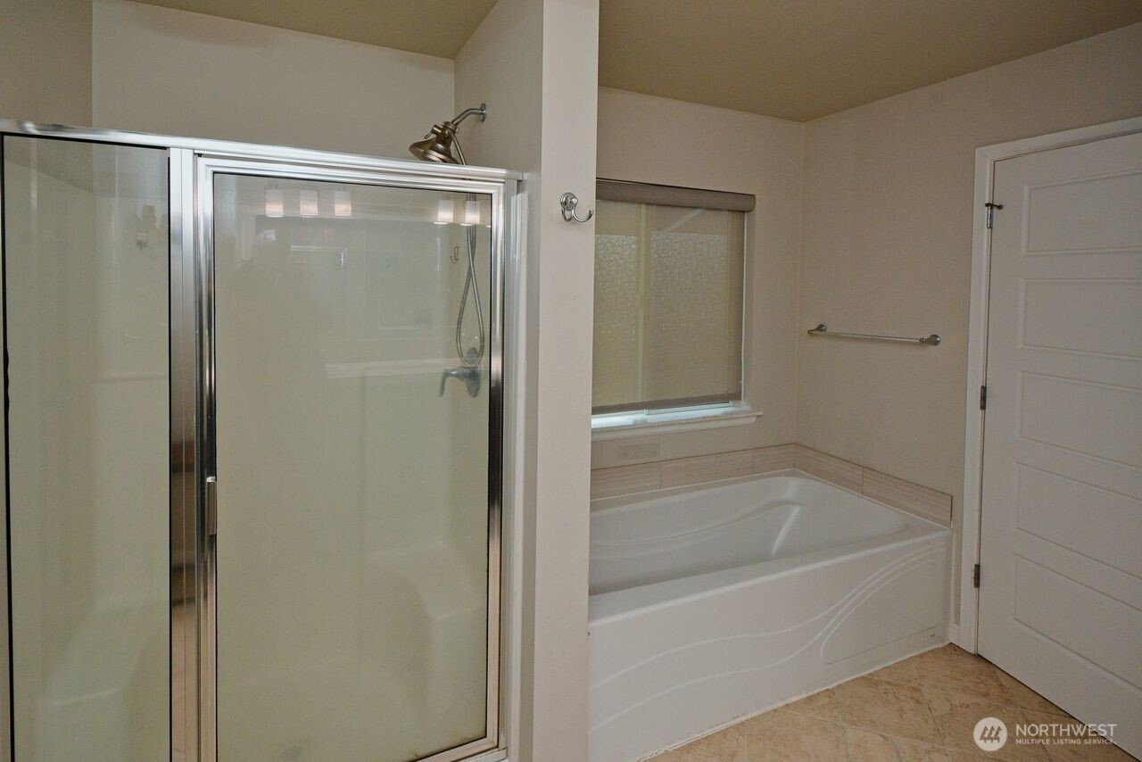 9976 Charles Street Southeast Yelm, WA 98597 - Photo 17 of 30 a bathroom with a bathtub