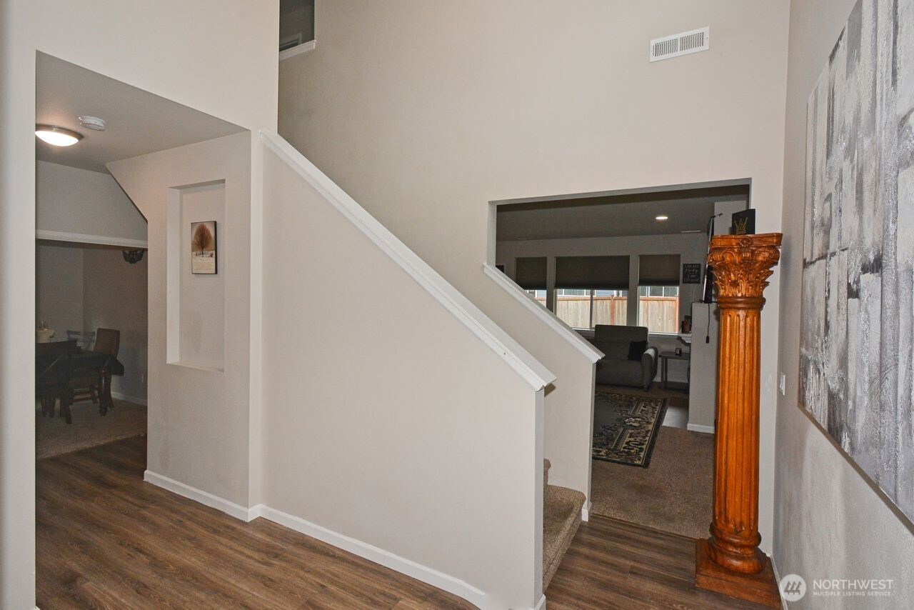 9976 Charles Street Southeast Yelm, WA 98597 - Photo 4 of 30 a view of a hallway with wooden floor and entryway