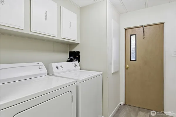 a view of storage and utility room with washer and dryer