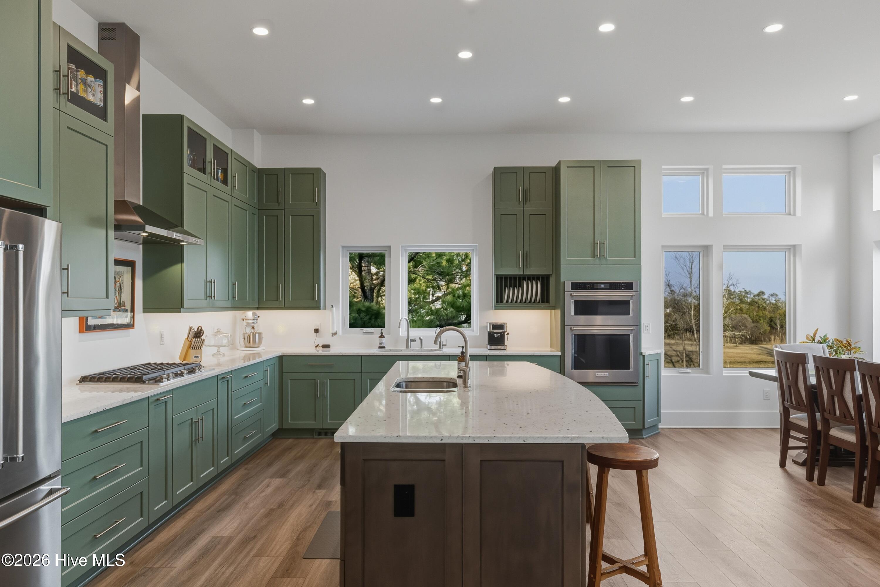 135 Heron Cove Road Hampstead, NC 28443 - Photo 12 of 89 Chef’s Kitchen with Large Island