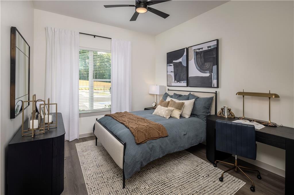 3108 McGinnis Ferry Road, Unit A6 Suwanee, GA 30024 - Photo 12 of 17 a bedroom with a bed and a window