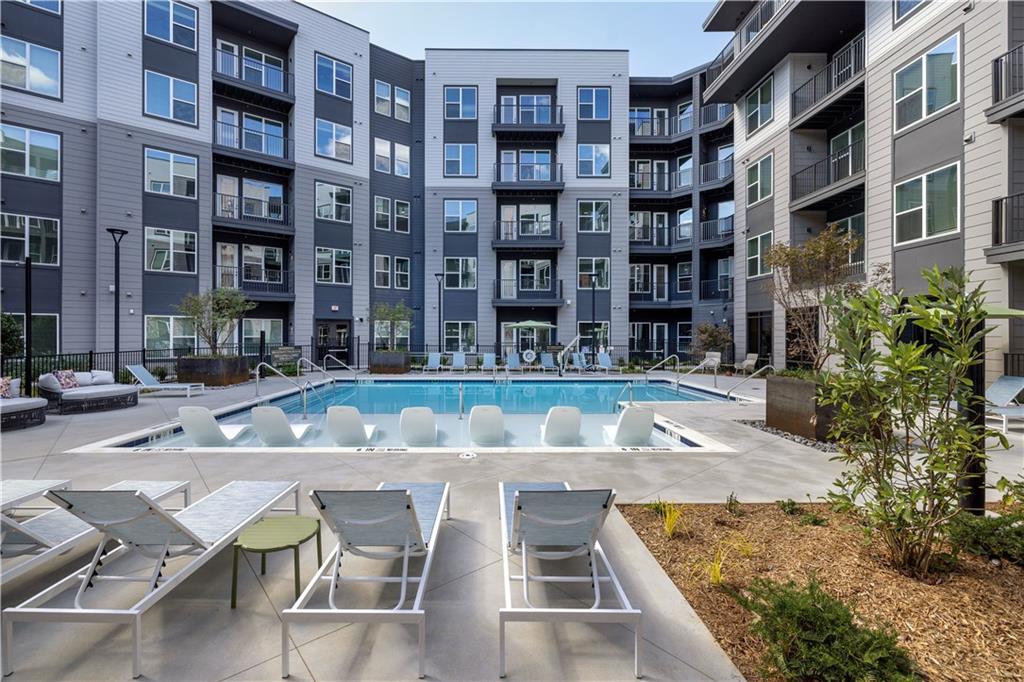 3108 McGinnis Ferry Road, Unit A6 Suwanee, GA 30024 - Photo 16 of 17 a view of an buildings with many windows