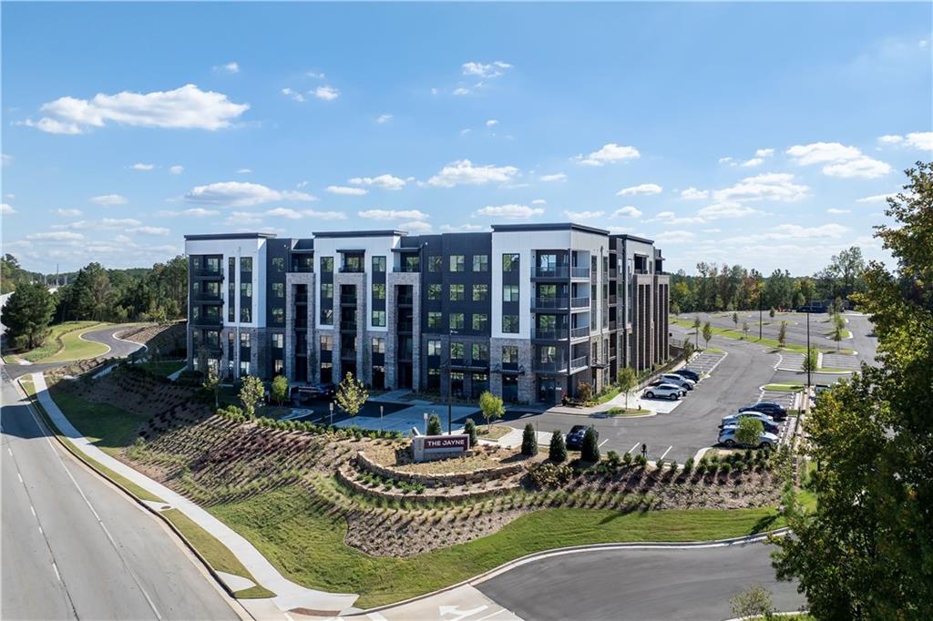 3108 McGinnis Ferry Road, Unit A6 Suwanee, GA 30024 - Photo 2 of 17 a view of a house with backyard and sitting area