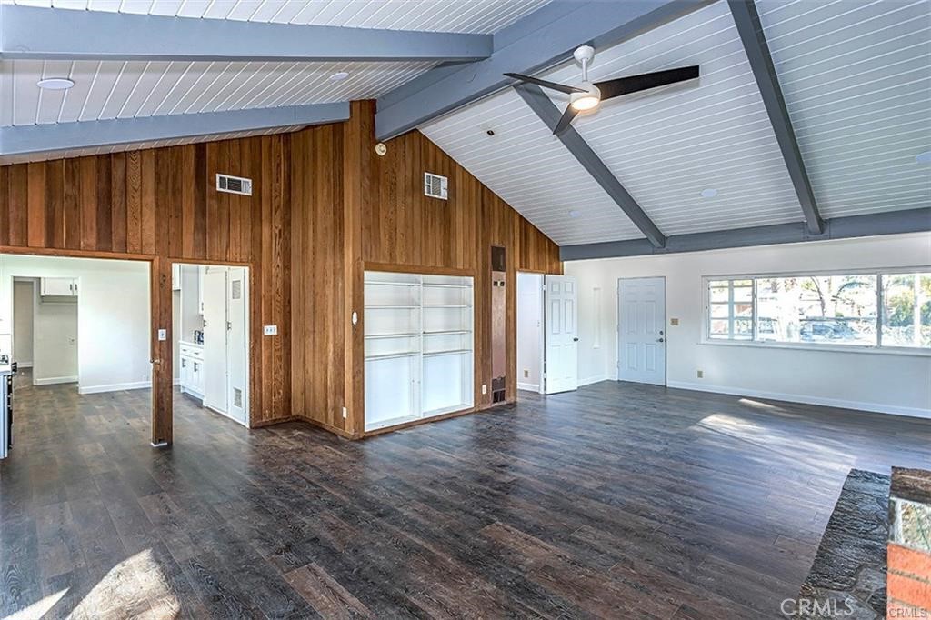 3454 Spruce Street Riverside, CA 92501 - Photo 4 of 6 a view of an empty room with wooden floor and a window