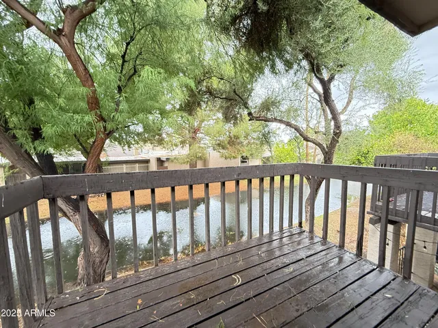 a view of swimming pool with a table and chairs