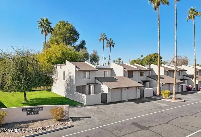 a view of swimming pool with a table and chairs