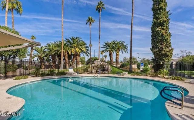 an aerial view of residential house with outdoor space and swimming pool