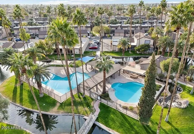an aerial view of residential house with outdoor space and swimming pool