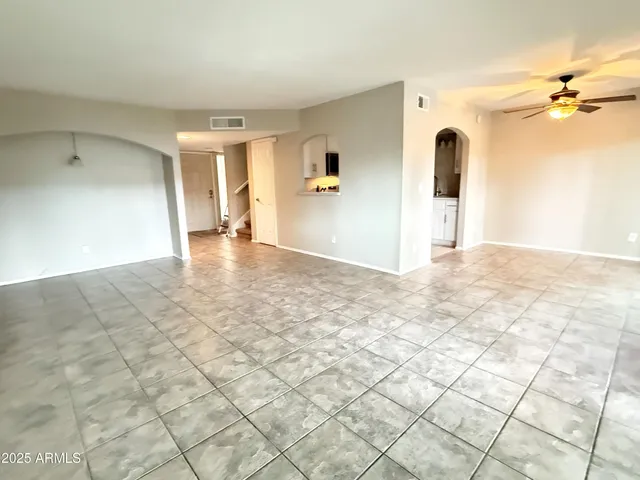 a view of a big room with windows and cabinet