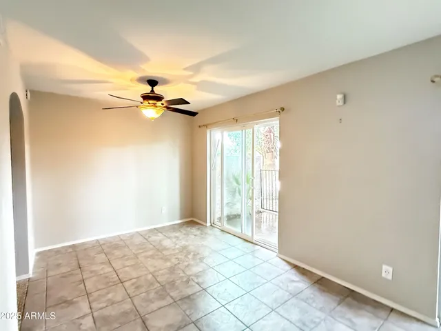 a view of an empty room and a window
