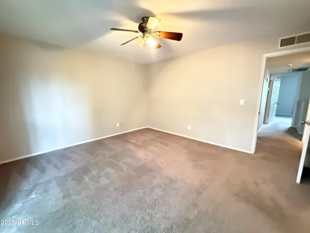 a view of a big room with carpet