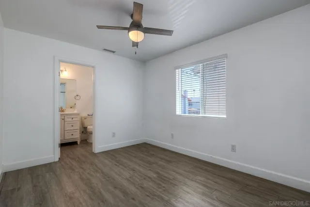 a bathroom with a sink a toilet and a shower