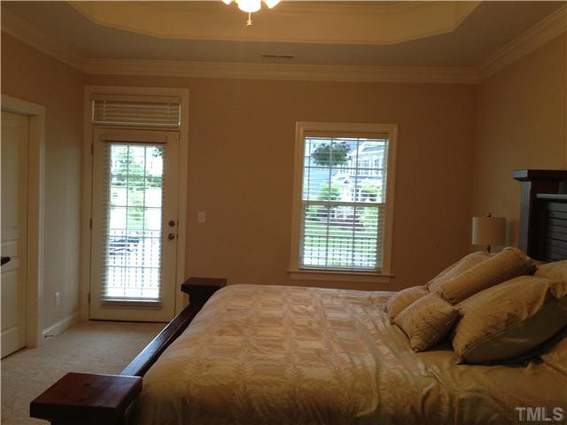 3614 Silver Forrest Lane Raleigh, NC 27614 - Photo 15 of 25 The large master bedroom has a trey ceiling and ceiling fan. Windows on two walls allow plenty of light and there is direct access to the second floor covered porch. Two large walk-in closets - one off the bedroom and the other off the master bath. Master Bedroom