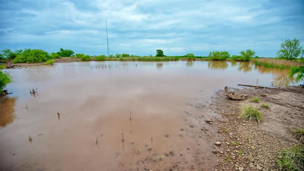 0 Watson Road Windthorst, TX 76389 - Photo 19 of 27 a view of a lake with houses in the back