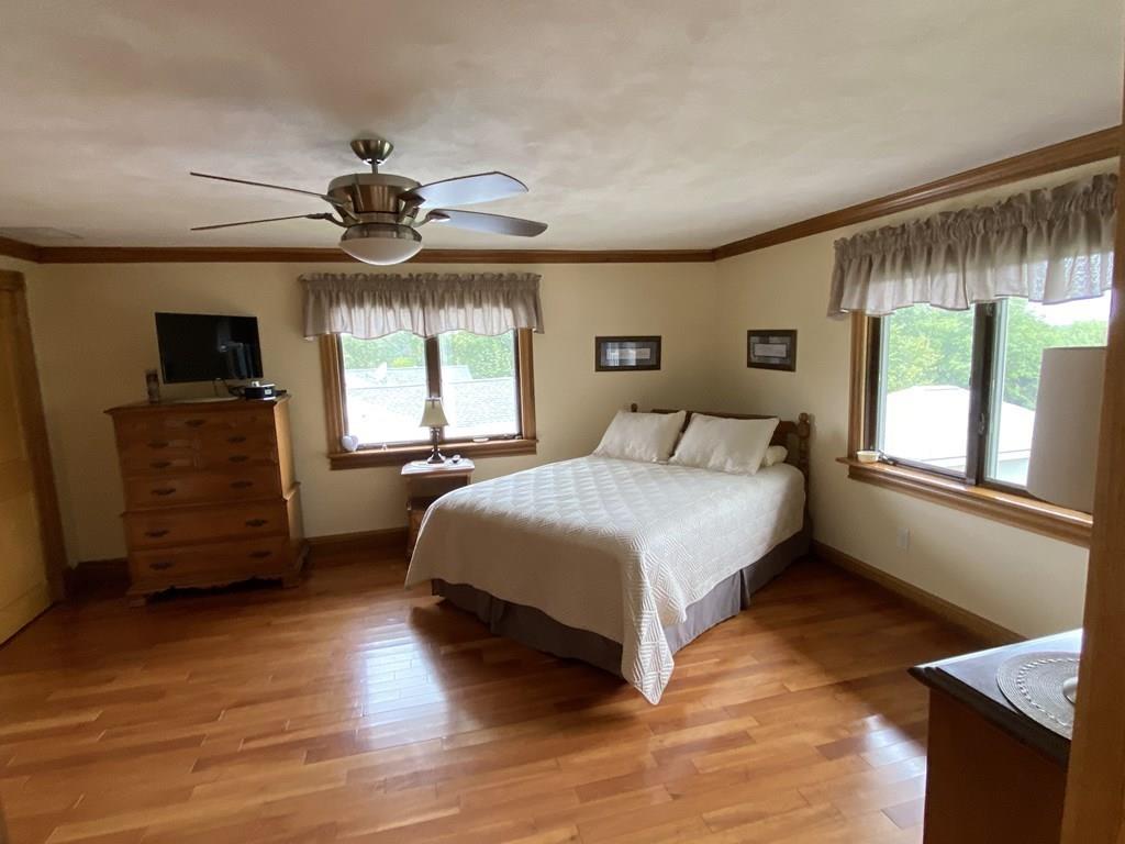 52 Gardiner Road Quincy, MA 02169 - Photo 9 of 21 a bedroom with a bed and a large window