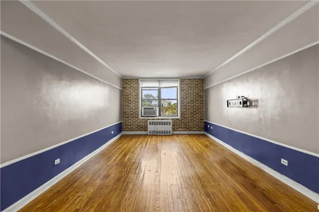 a view of room with wooden floor