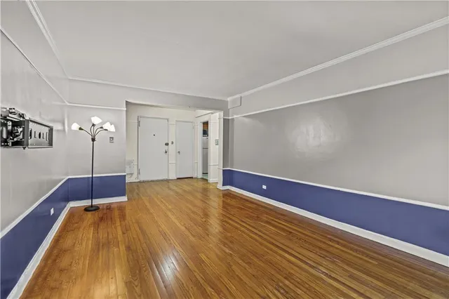 a view of a refrigerator in kitchen and a window