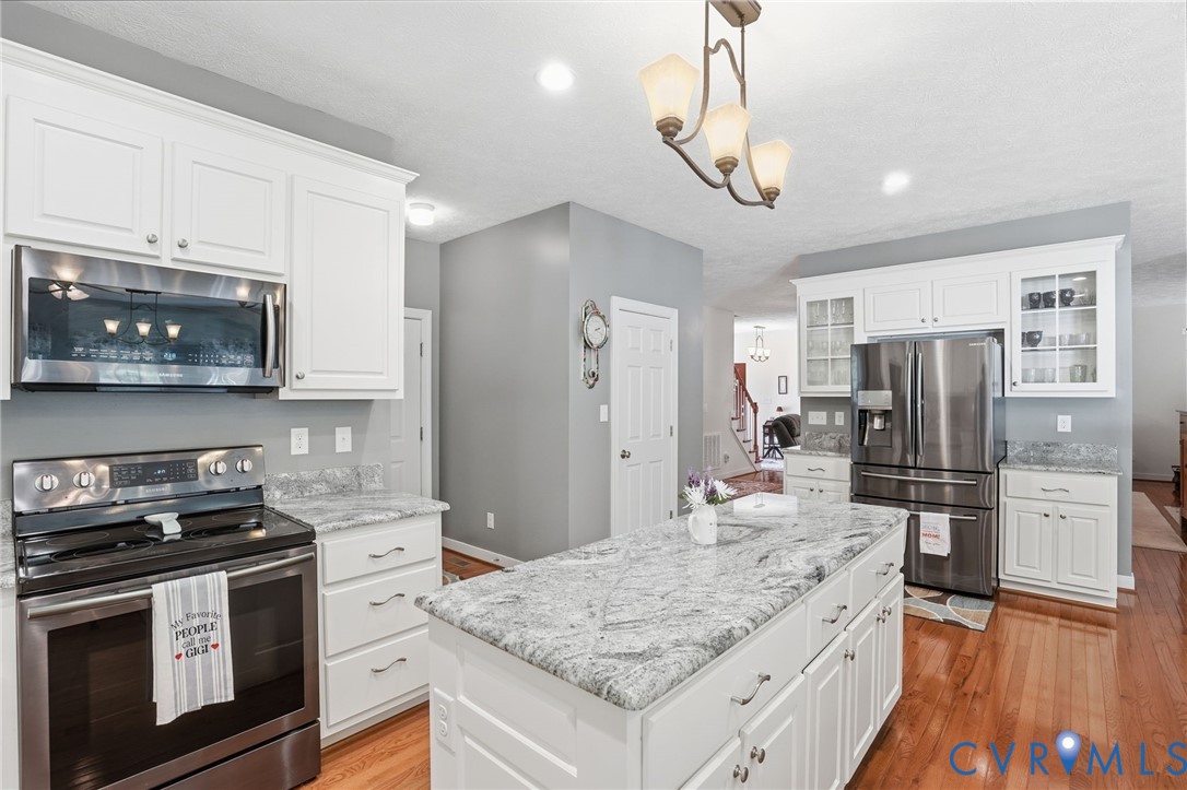3600 Market Road Mechanicsville, VA 23111 - Photo 15 of 67 a kitchen with stainless steel appliances granite countertop a stove refrigerator and microwave