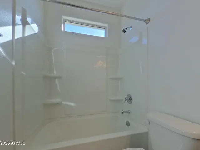 a en suite bathroom with a sink and a mirror