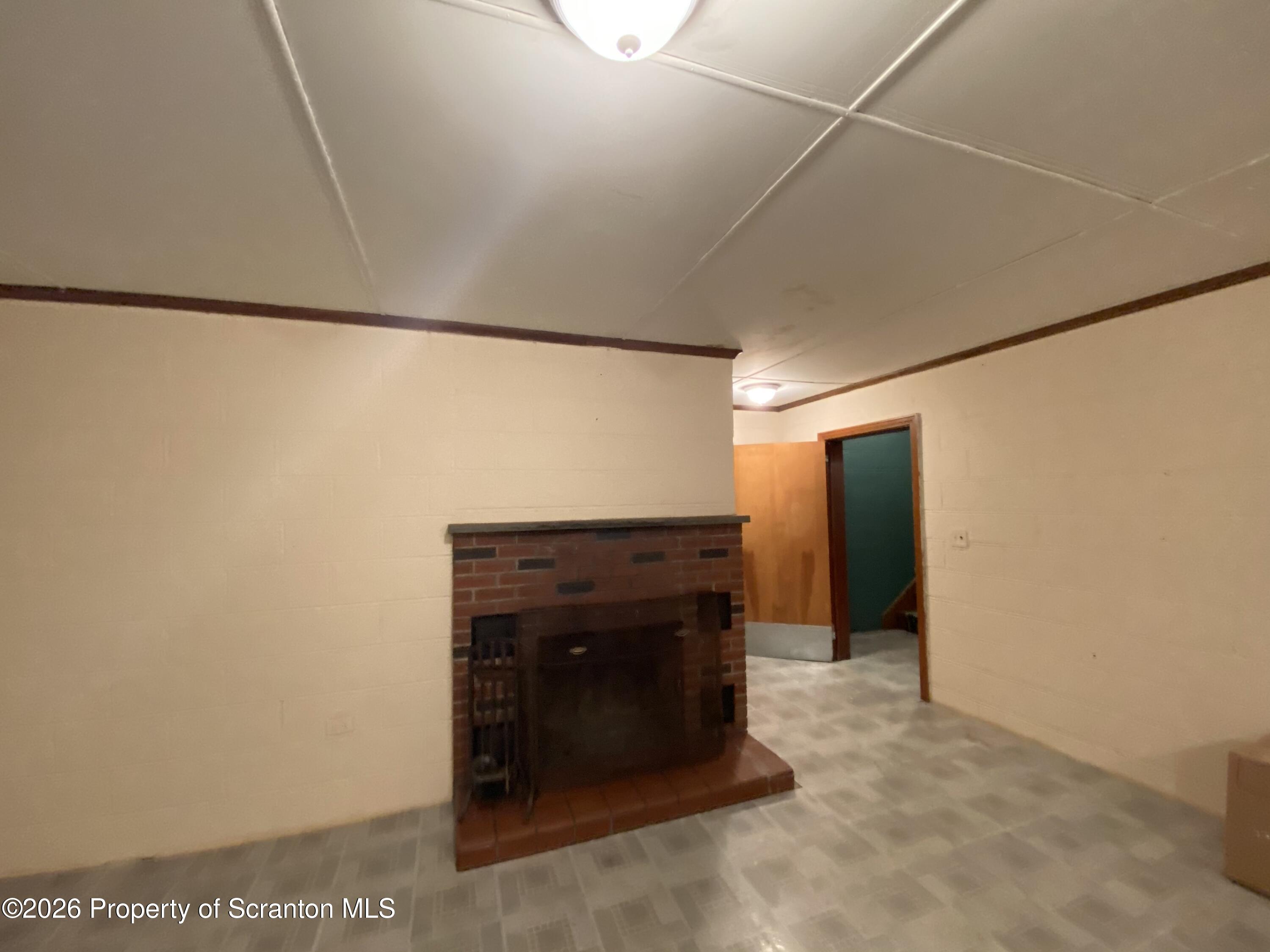 414 Orchard Street Scranton, PA 18505 - Photo 19 of 20 a view of an empty room and fire place