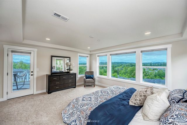 a bed room with a bed and a dresser