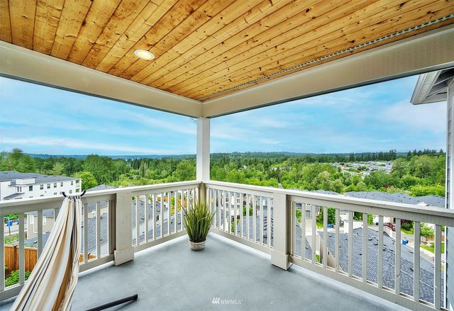 a view of a two chairs in the balcony