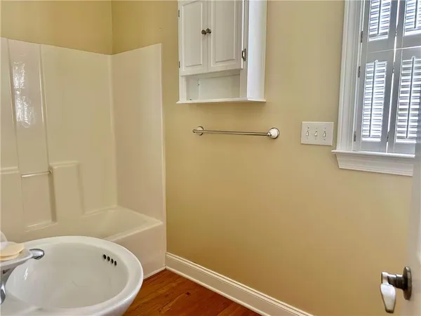 a bathroom with a bathtub and shower
