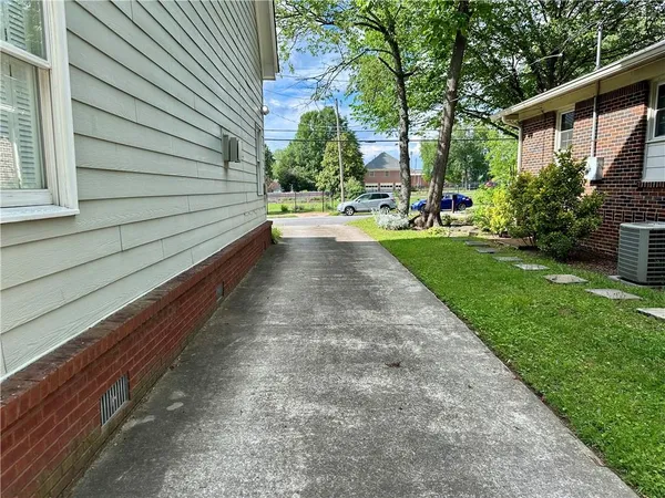 a view of park with large trees