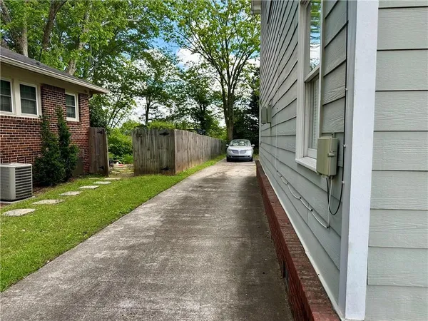 a view of a pathway with a backyard