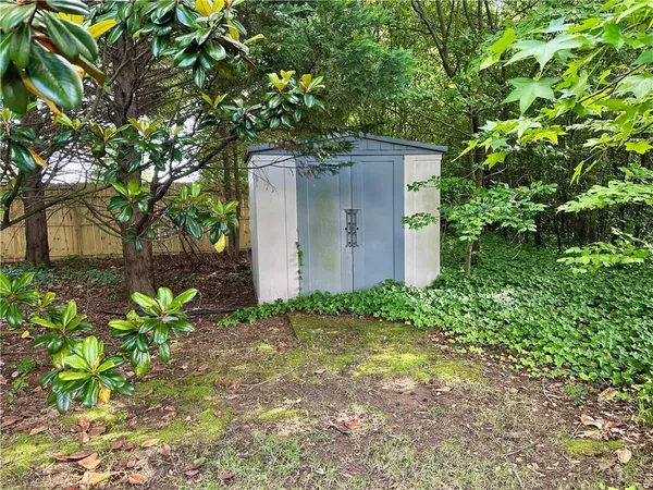 a backyard of a house with lots of green space