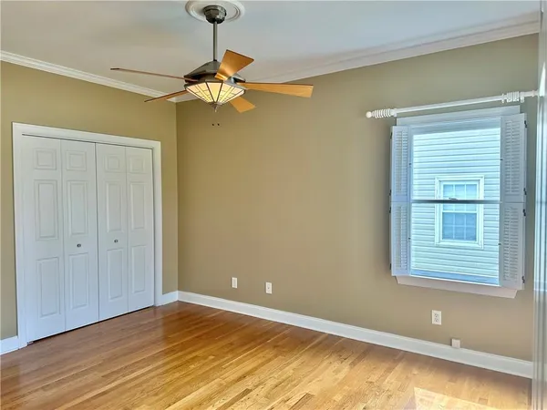 a view of room with window and ceiling fan