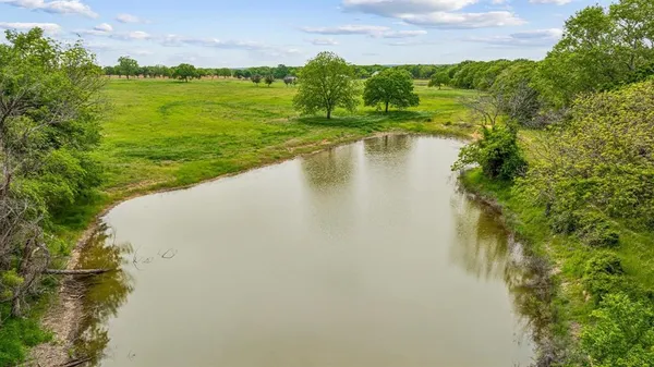 a view of a lake with a yard
