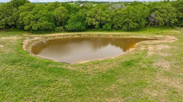 a view of a swimming pool and a yard
