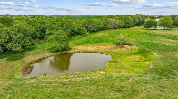 a view of a lake with a yard