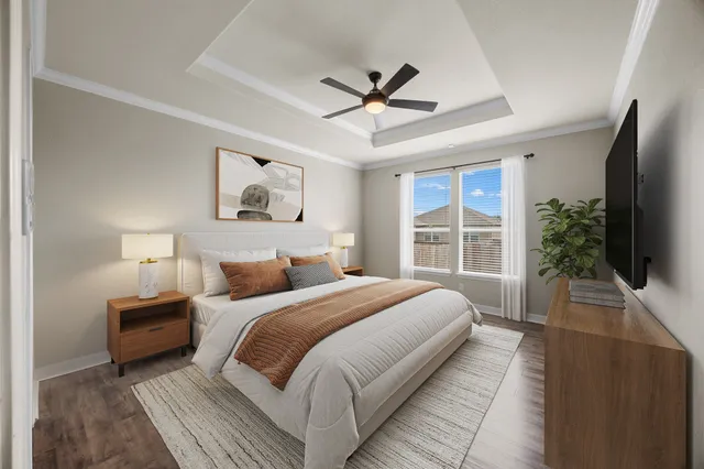 a bedroom with bed and a large window