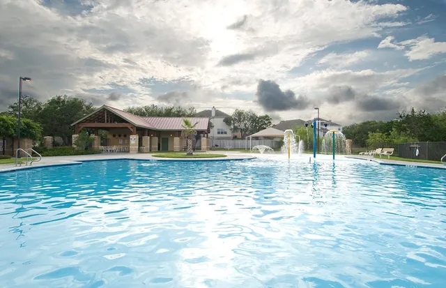 a view of a swimming pool with a lake view